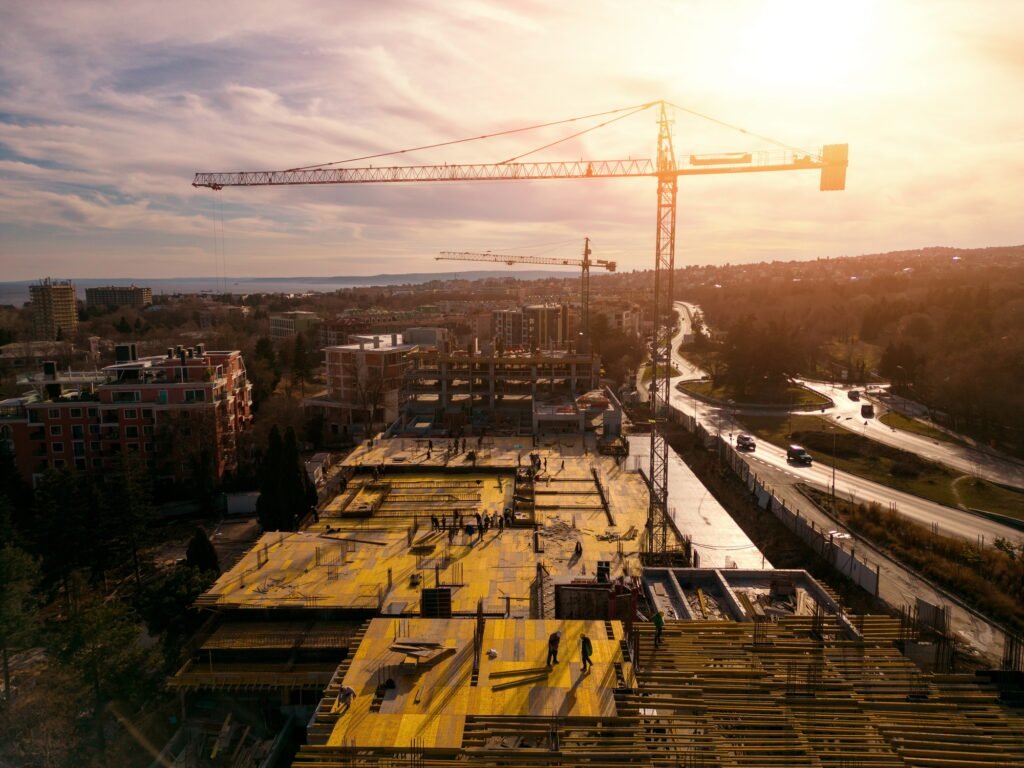 Busy Construction Site and Construction Equipment on the sea coast Aerial view